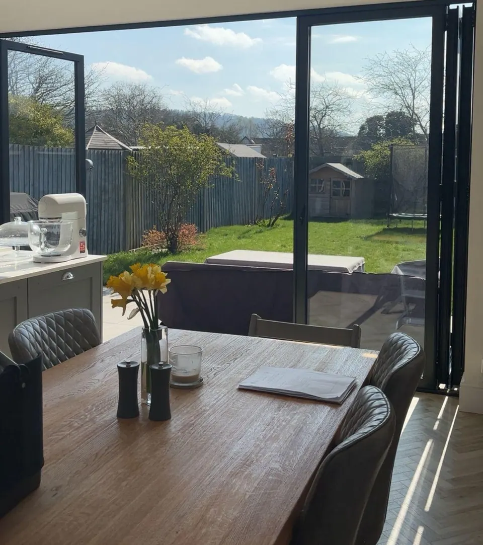 Bright kitchen diner with bifold doors onto the garden, cleaned by Our Cleaning Company
